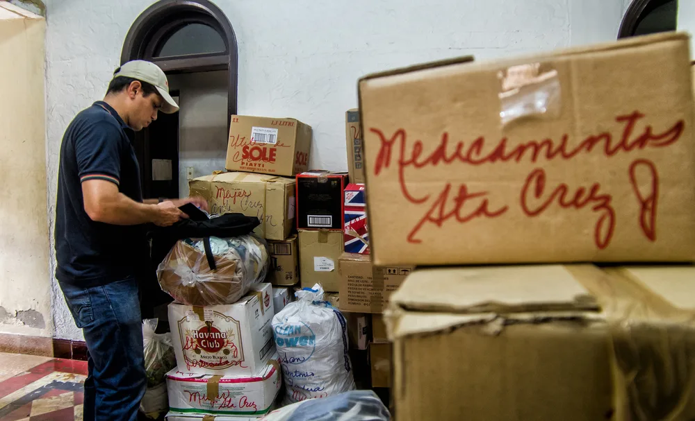 Man gets ready to distribute medicine for hurricane relief after Irma in Havana Cuba as one of the valid reasons Americans can visit the country