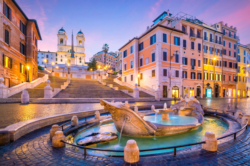 The Spanish Steps in back of a boat fountain in Rome, a top picks for a must-visit place in Europe