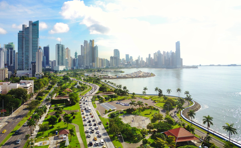 For a roundup of the best places to visit in Central America, the modern skyline of downtown Panama City towers over the roads and water below