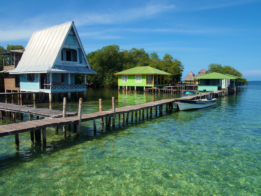 Small Caribbean resort in one of the best places to visit in Panama, Bocas del Toro, pictured with stilted homes above the water