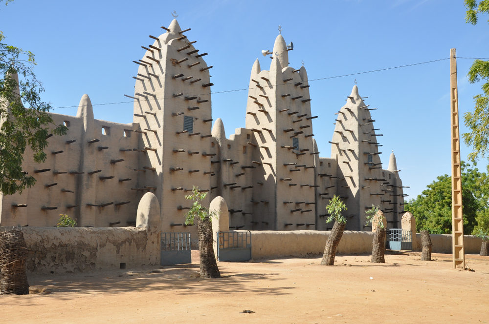 Djenne Mosque seen from an angle on a blue sky day during the least busy time to visit Mali