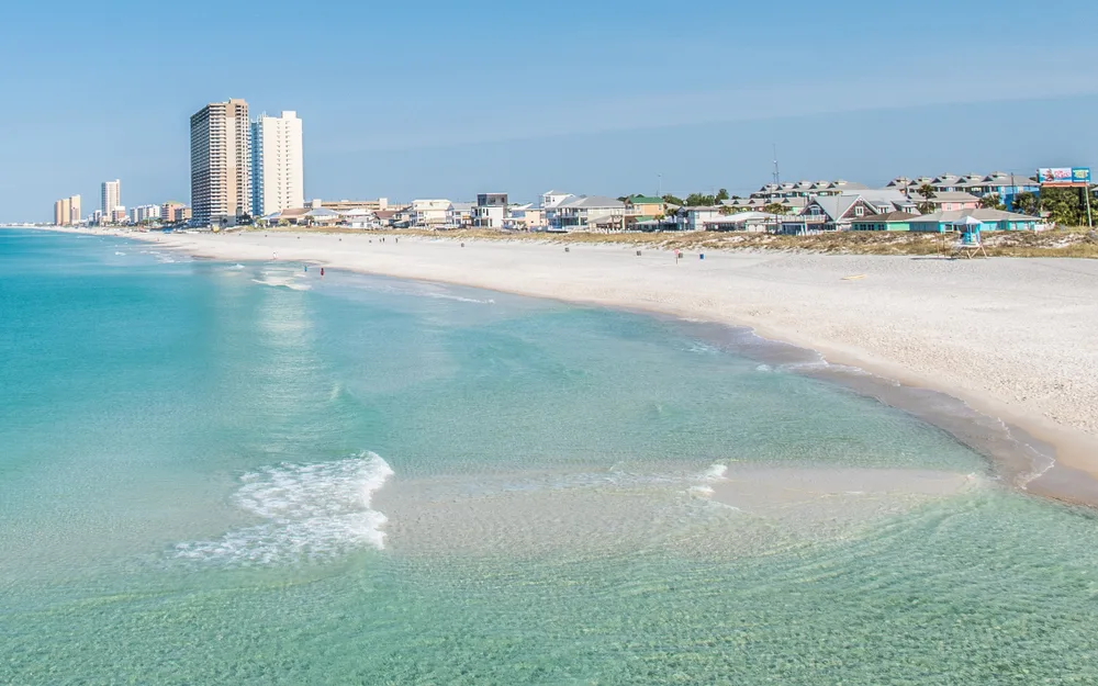 Panama City Beach shoreline with hotels in the background on a clear day showing the 4th best beach in Florida