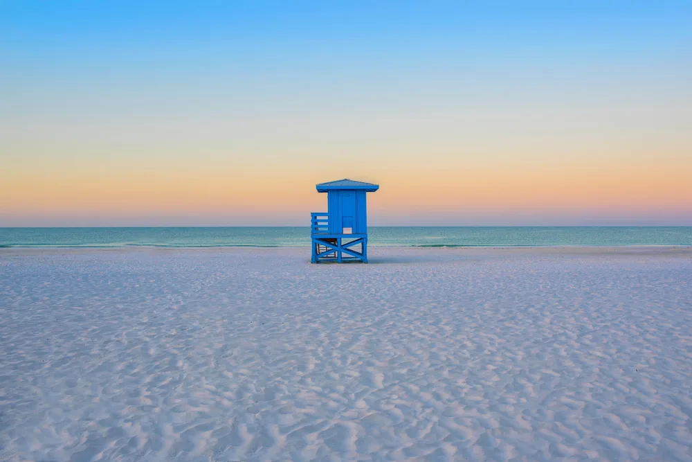 Lifeguard hut on Siesta Key Beach near Sarasota at sunset to show one of the top 3 beaches in Florida