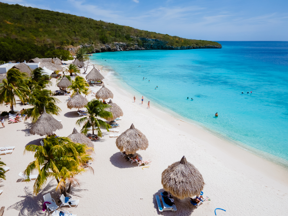 For a piece titled Is Curacao Safe to Visit, an aerial shot of the Playa Cas Abou beach