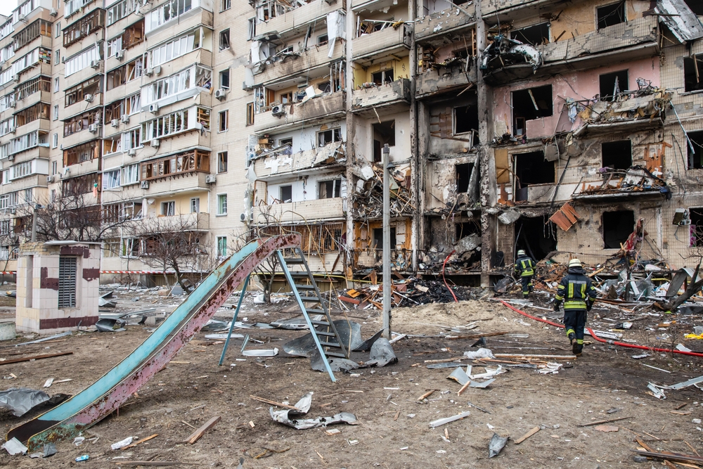 Bombed-out buildings and playground in Kiev for a guide titled Is Kiev Safe to Visit