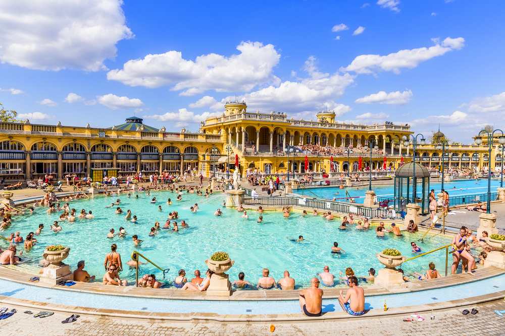 Budapest Hungary baths filled with tourists on a warm April day during the best time to visit Hungary overall