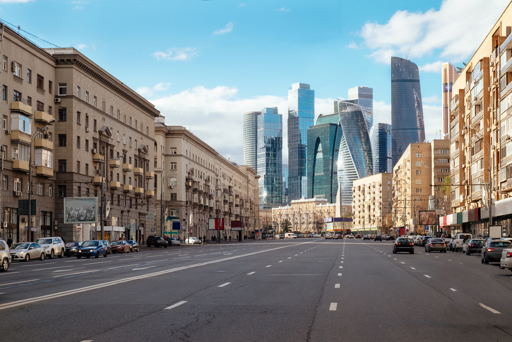 Downtown skyline of Moscow pictured for a guide titled is Moscow safe to visit with empty streets leading to the tall buildings
