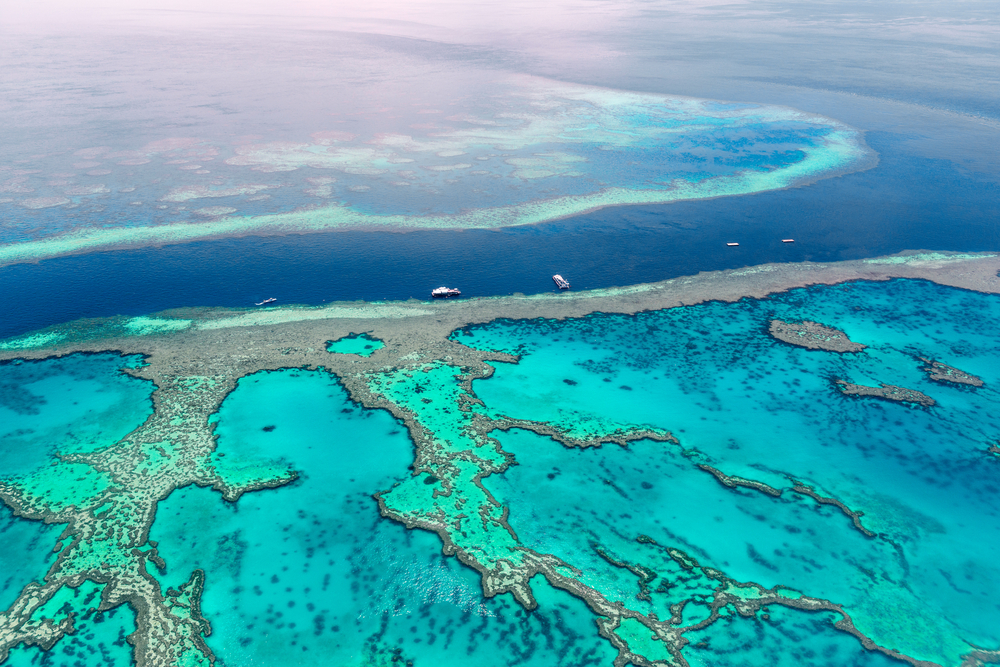 Aerial view of the Great Barrier Reef, one of the best places to visit in February, off the coast of Australia in the Coral Sea