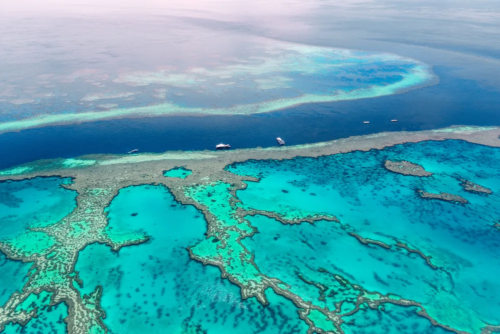 Aerial view of the Great Barrier Reef, one of the best places to visit in February, off the coast of Australia in the Coral Sea
