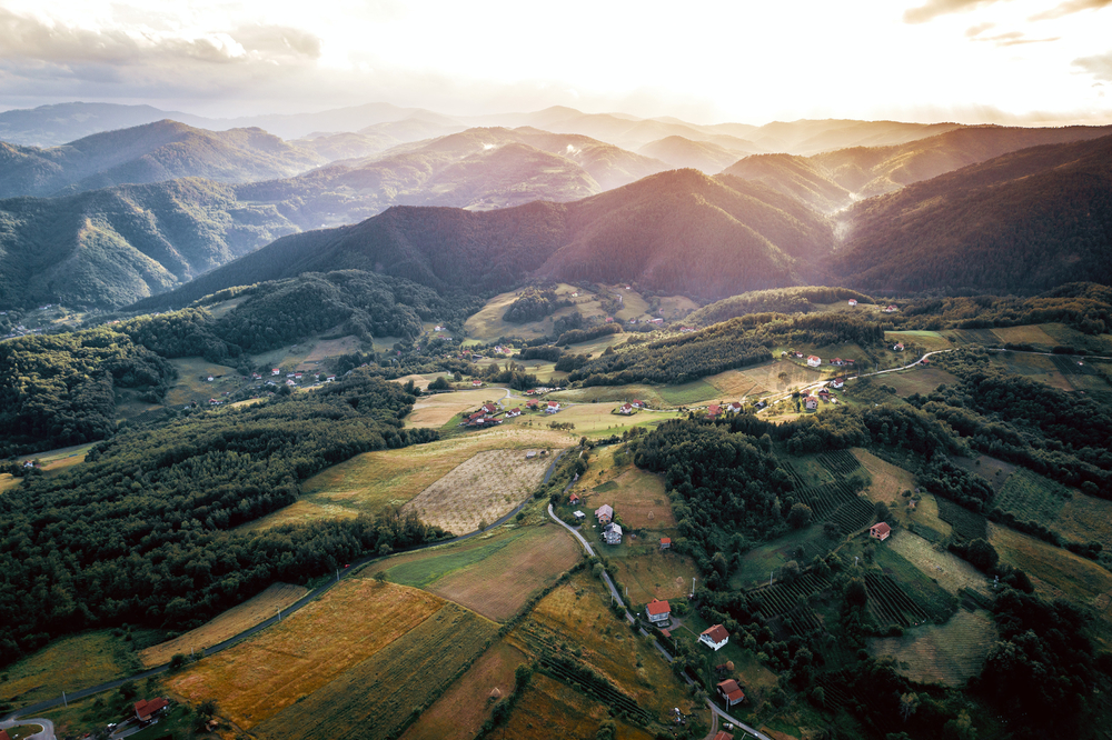 Aerial view of the Dinaric Alps and villages of the Zepce area during the overall best time to visit Bosnia