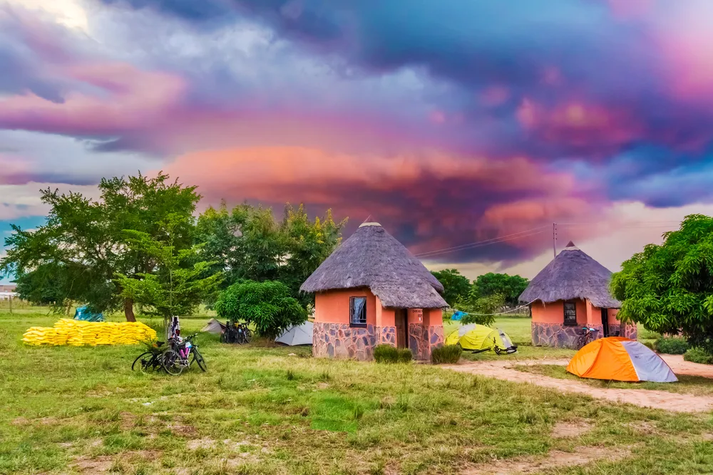 Picturesque sunset over the small huts near camp Kalomo during the best time to visit Zambia