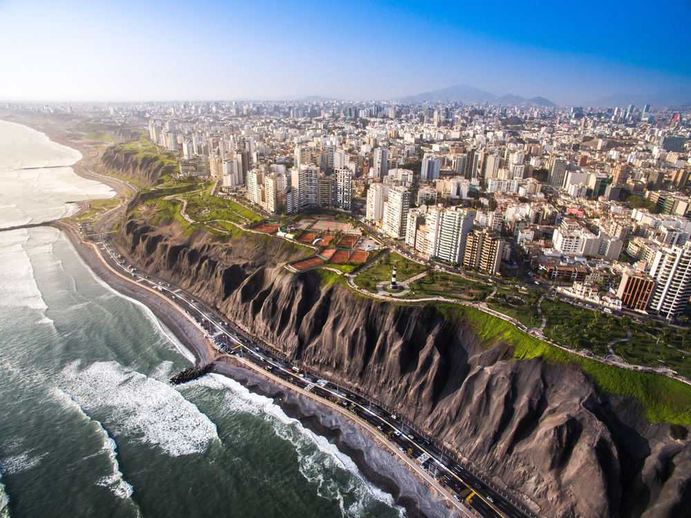 Aerial view of coastal Lima, Peru with waves crashing to show one of the most dangerous countries in South America