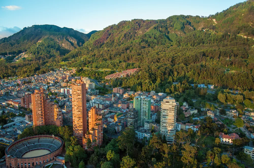 Aerial view of the capital Bogota with Andes Mountains in the background to show the 2nd most dangerous country in South America