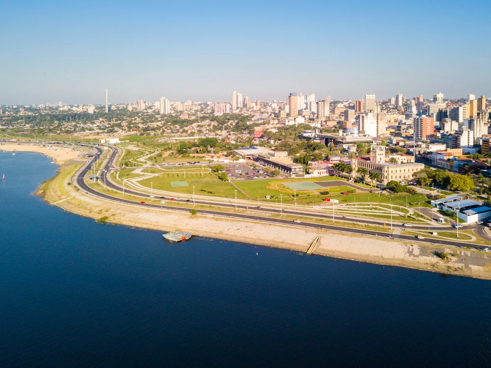 Aerial view of Asuncion City in Paraguay along the Paraguay River Embankment on a clear day to indicate one of the most dangerous countries within South America