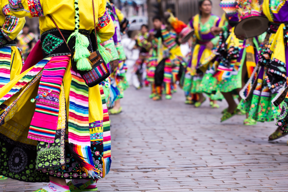Peruvian dancers' feet seen at a parade with colorful dress in Cusco, Peru, which is one of the most dangerous countries in South America