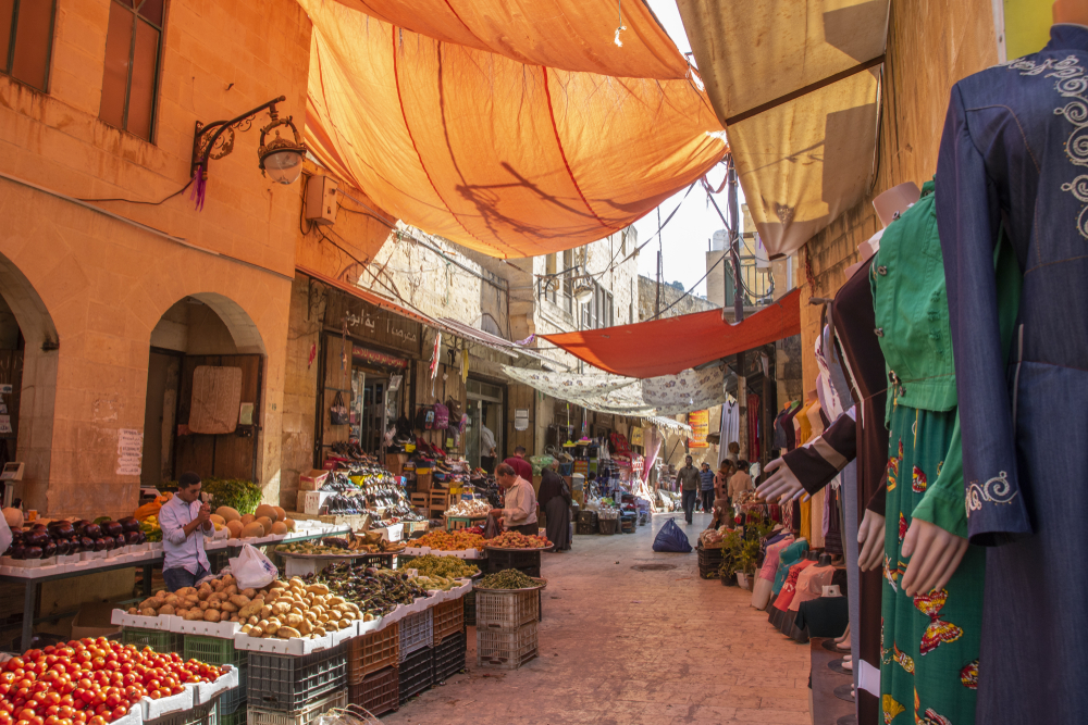 Popular Hammam Street Market, pictured during the best time to visit Jordan, as seen in the city of As-Salt with few patrons shopping