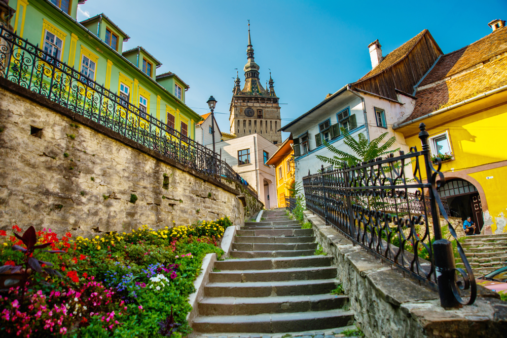 Neat view of the old building in Sighisoara citadel for a piece titled is Romania safe to visit