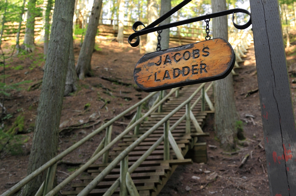 Sign that says Jacob's Ladder pictured next to a steep staircase running up the side of a hill in Nova Scotia
