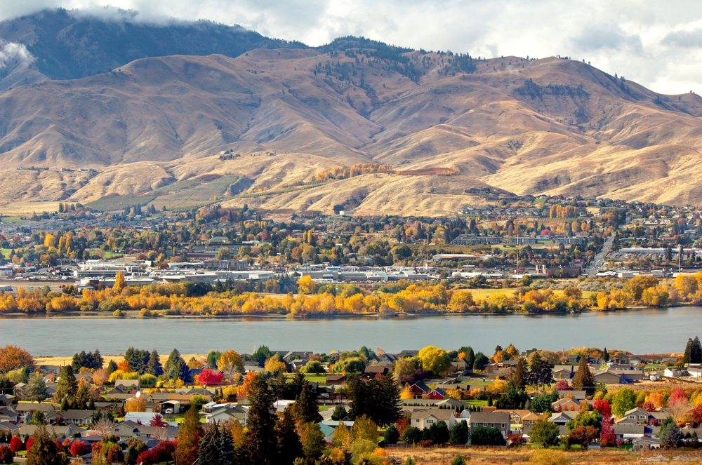 Aerial view of Wenatchee, one of the best areas to stay in Leavenworth Washington, pictured with the Columbia River running through the middle