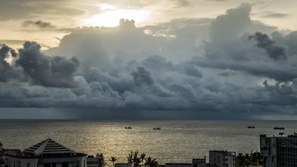 Cloudy skies over the coast near Libreville before sunset shows the worst time to visit Gabon during the rainy season
