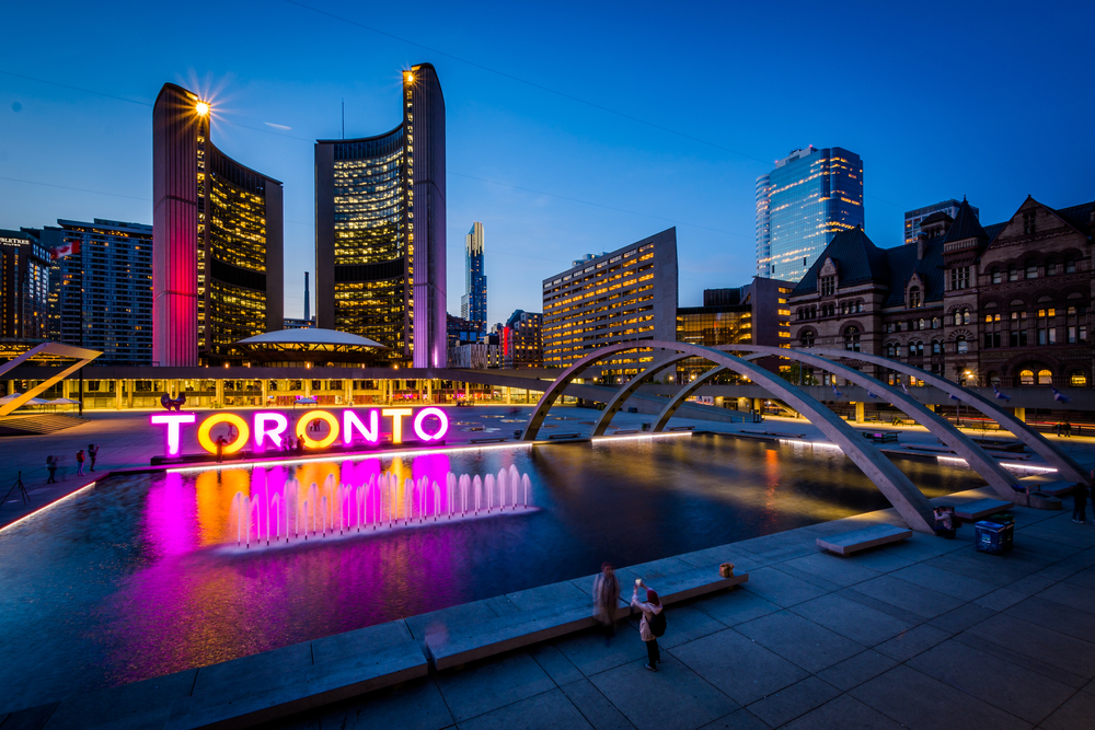 Night view of the lights illuminating Nathan Phillips Square in Toronto for a piece titled is Canada safe to visit