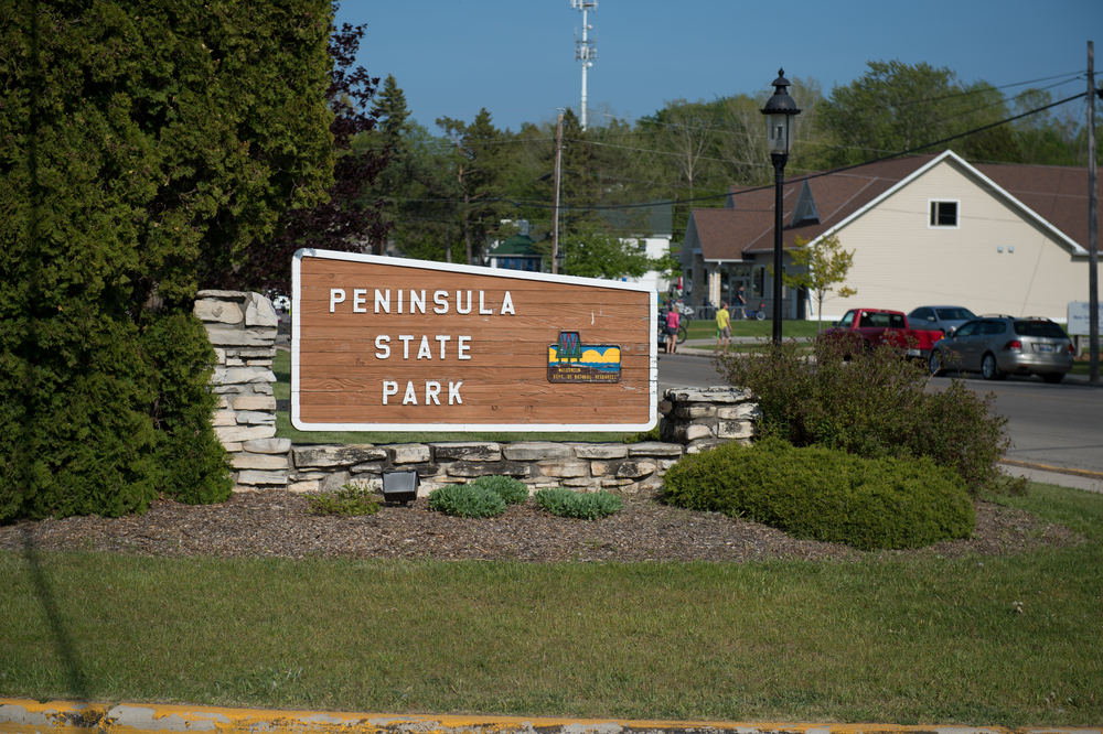 Photo of a sign that says Peninsula State Park in Fish Creek, one of the best places to stay in Door County