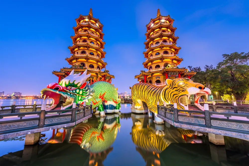 For a piece titled Is Taiwan Safe to Visit, a pair of dragons and lions opening their mouths and welcoming tourists into the steps in their mouths at the Lotus Pond