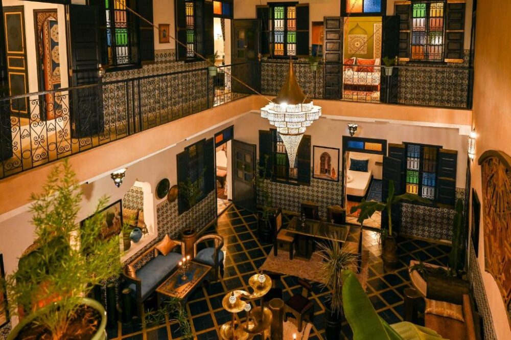 Interior of the extremely eccentric Riad Nouceiba Marrakech, one of the best riads in the city, with its deep black and gold décor