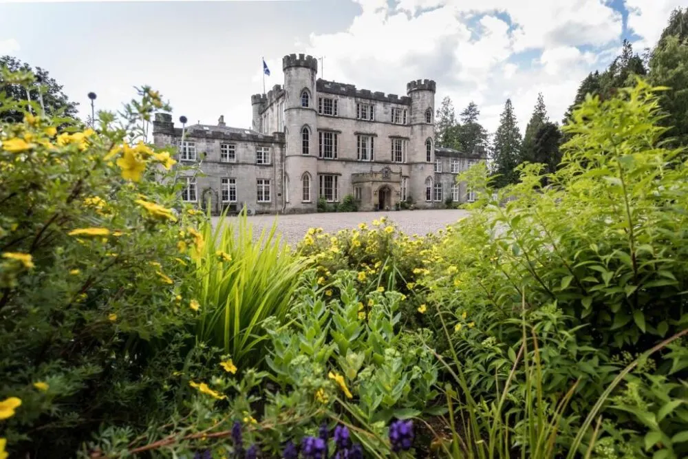 Outside of the Melville Castle Hotel, one of the best castle hotels in Scotland, pictured from the driveway
