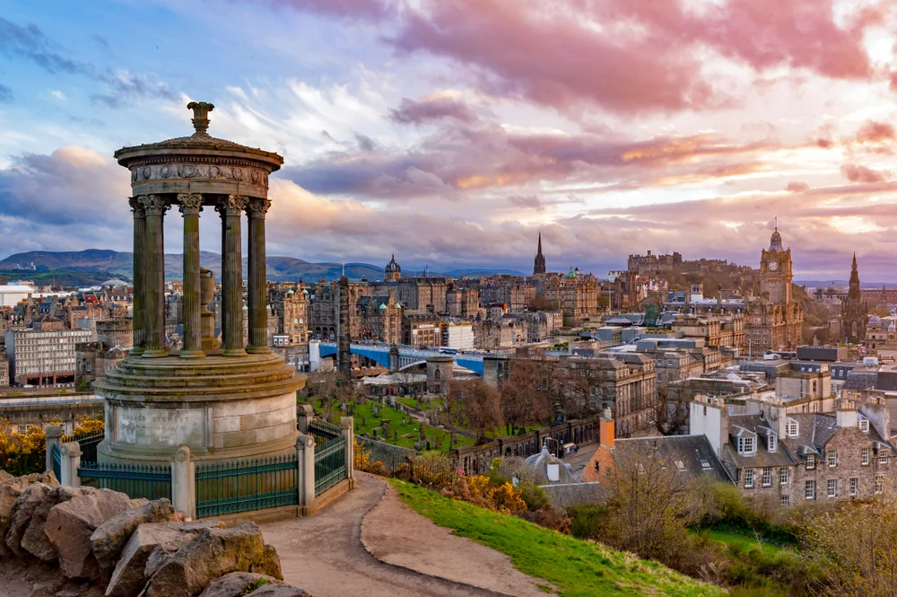 The picturesque skyline of Edinburgh seen on an cloudy-sky evening from the top of Calton Hill