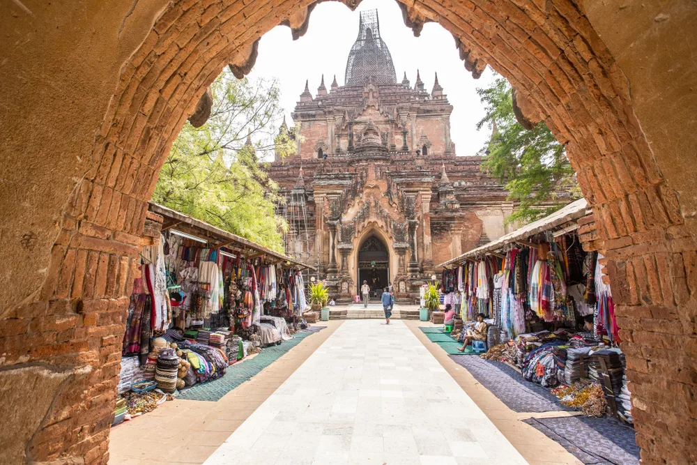Bagan Temple in Myanmar pictured during the least busy time to visit with hardly anyone around and little shops on either side of the walkway