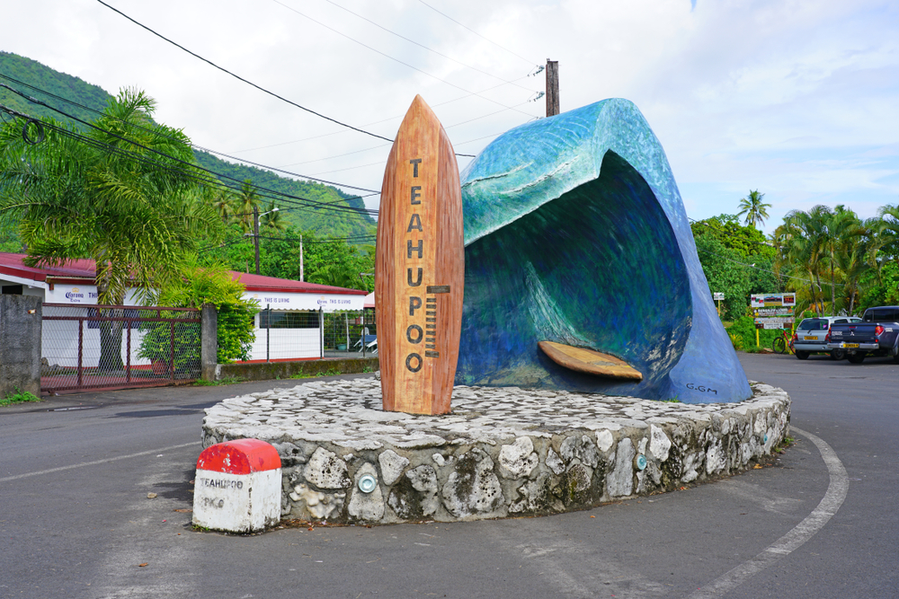 Neat monument commemorating the surf competitions of days past outside a parking lot for the beach of Teahupoo, one of the areas to use caution in when visiting Tahiti