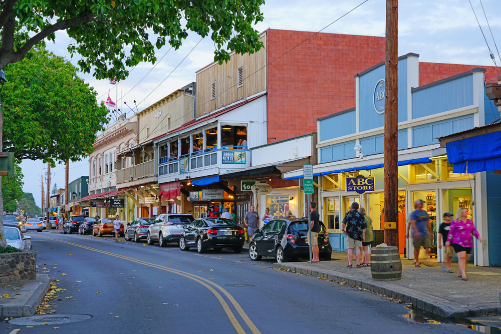 Colorful buildings on the side of the road in Lanai with an ABC Superstore pictured in the middle of them