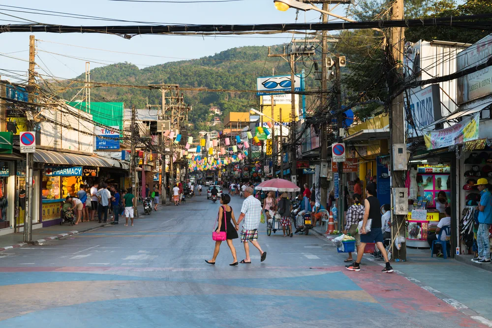 For a piece on the areas to be wary of when visiting Phuket, a photo of Patong Bangla Road is depicted with lots of tourist making their way around the area