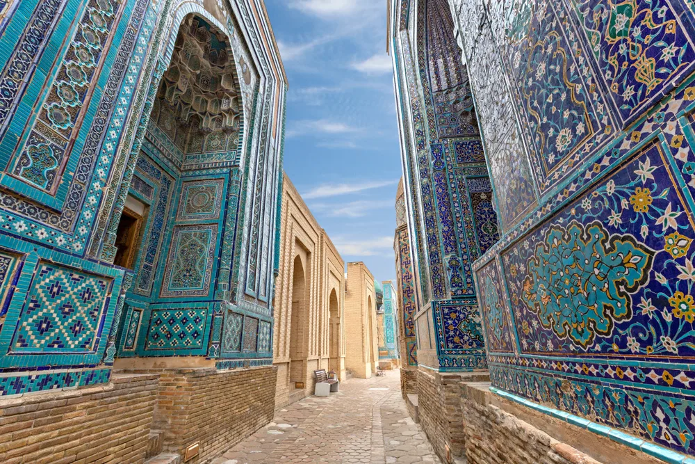 Neat and colorful blue walls of the Necropolis in Shakhi Zinda for a guide to whether or not it is safe to visit Uzbekistan
