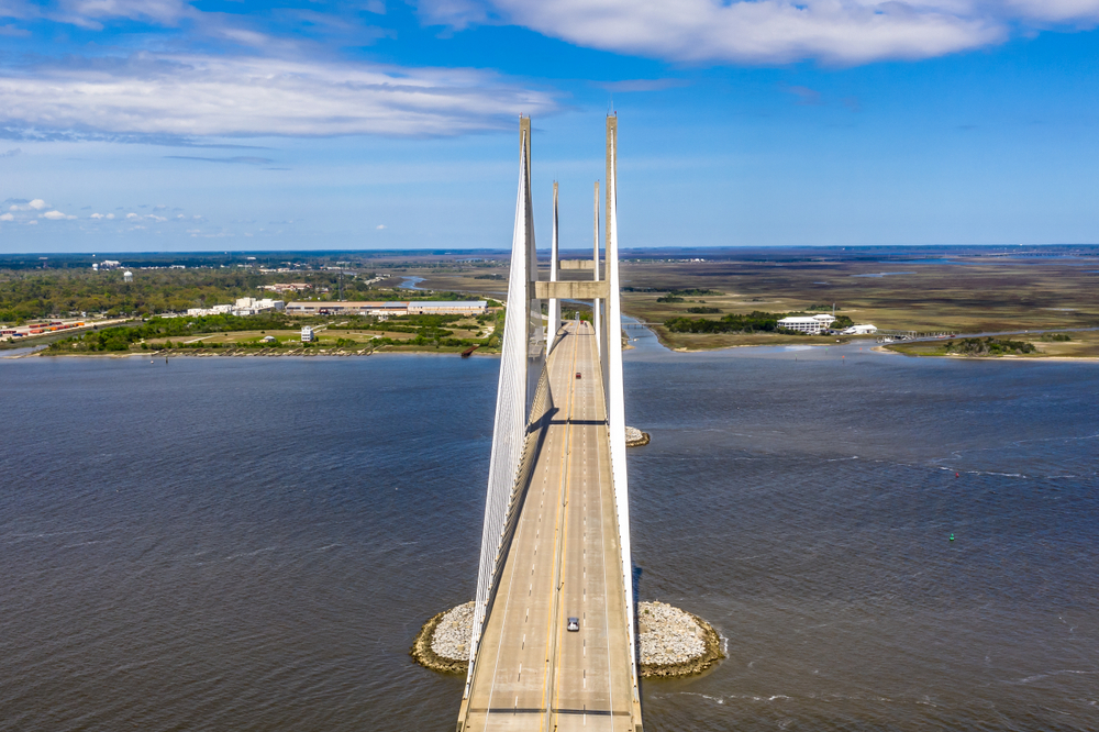 Sidney Lanier Bridge pictured spanning the water of the ocean during the best time to visit Jekyll Island