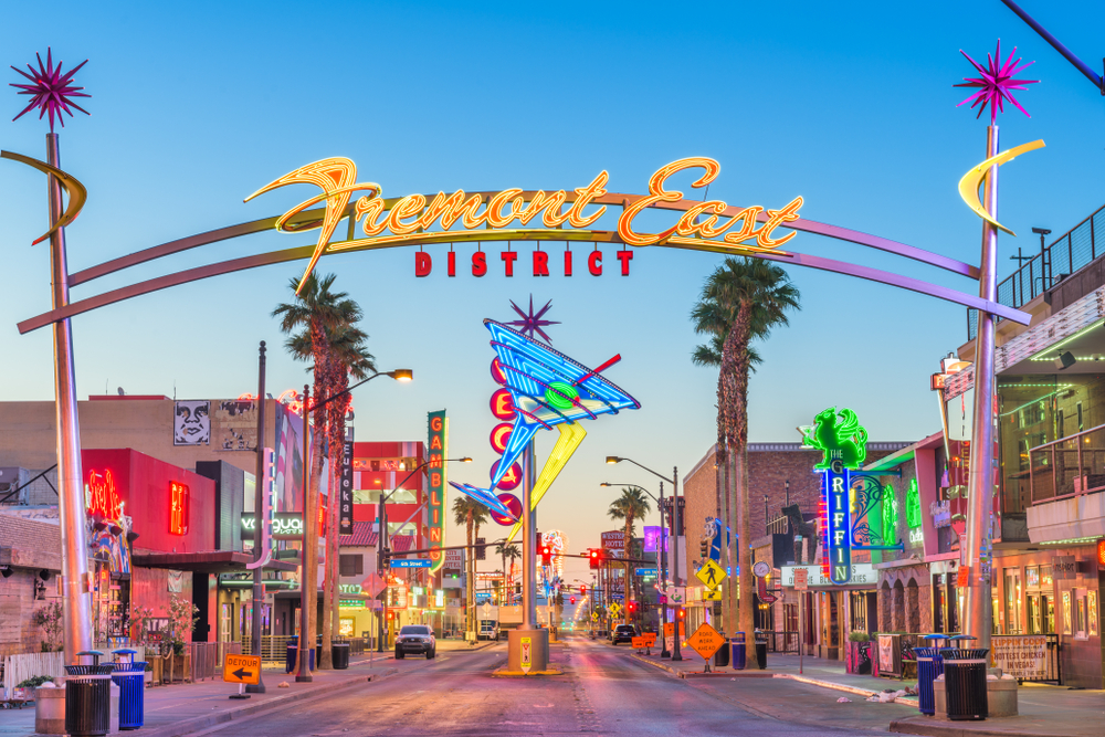 Fremont Street neon signs lit up at dawn in Las Vegas, one of the best places to go for your birthday to gamble, enjoy great food, and fun activities