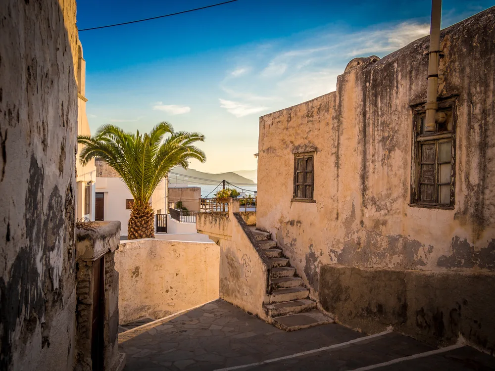 Gorgeous Kastro in Chora, one of the best areas to stay when in Naxos, pictured with a blue sky in the background