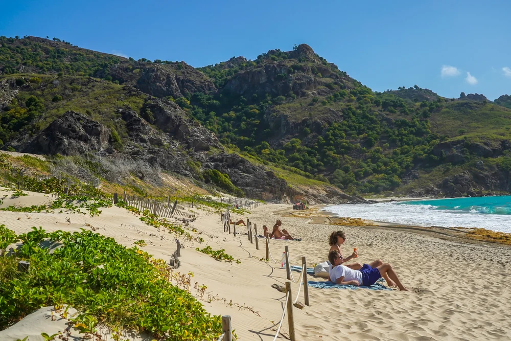 Photo of a people on popular Saline Beach to show that there are no really unsafe places to visit in Saint Barts