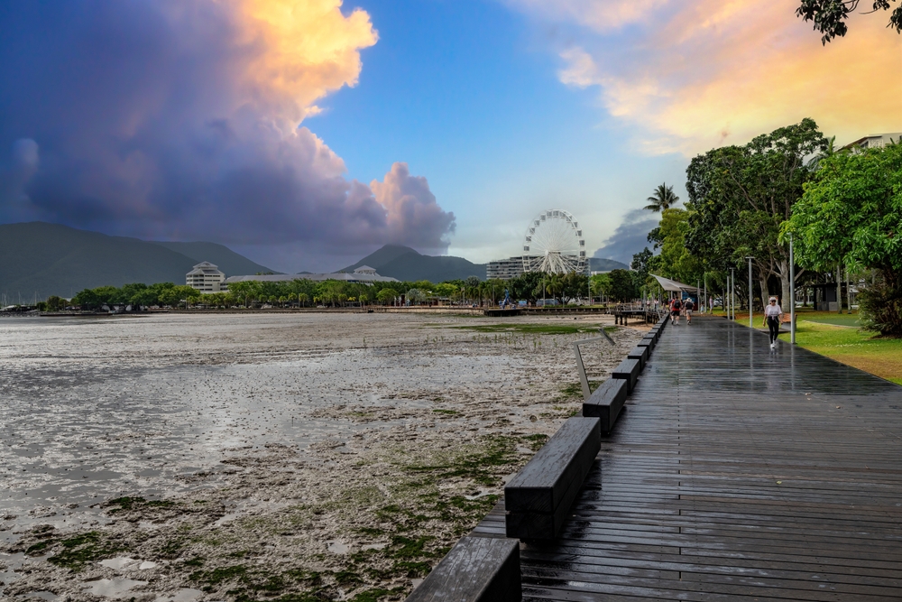 Lone woman walking along the boardwalk in Cairns, the gateway to the Great Barrier Reef