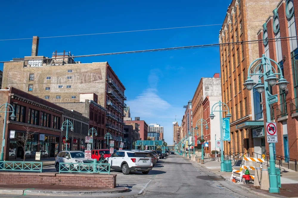 Photo of the historic third ward pictured on a blue-sky day with cars lining parking spaces in the street