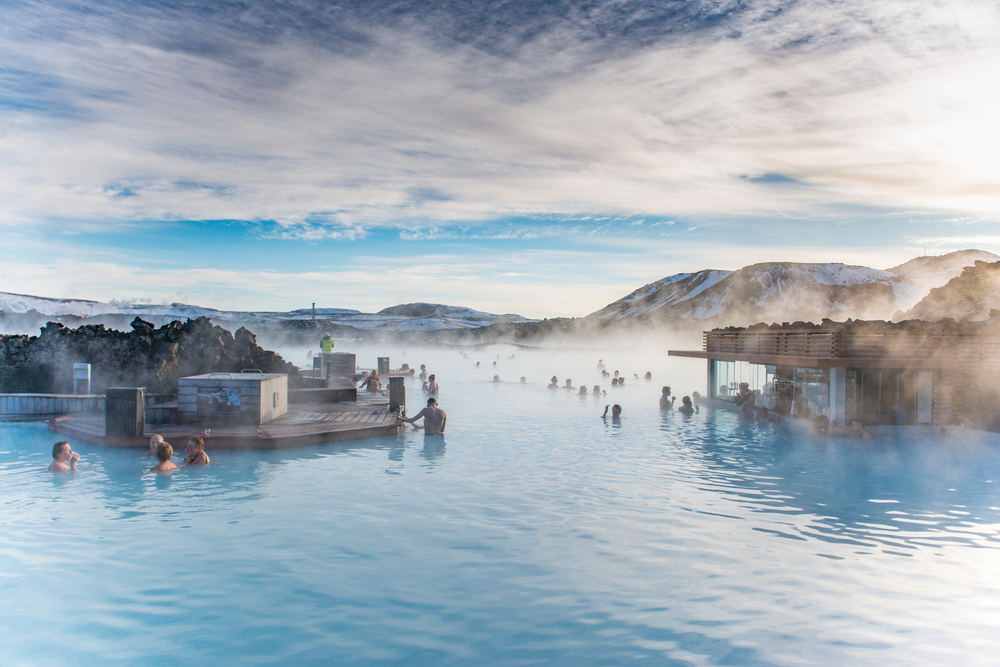 People below the rising water at the Blue Lagoon in Iceland