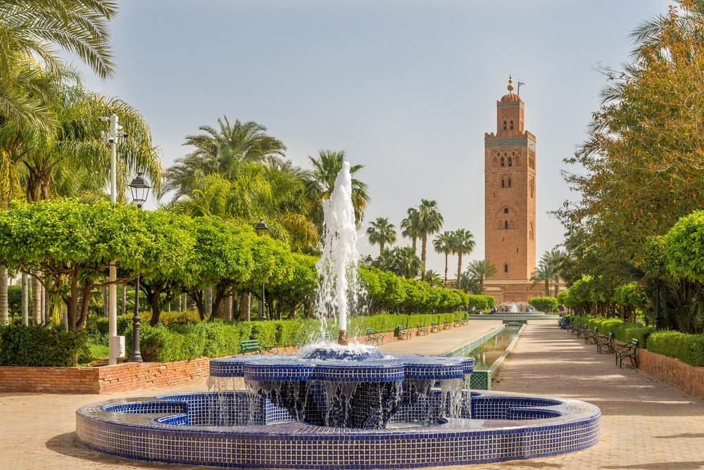 View of the Koutoubia Mosque and minaret from the fountain showing why you should visit Marrakech