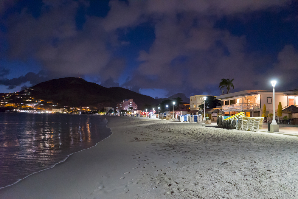 Night view of the Philipsburg boardwalk as seen from the beach at night