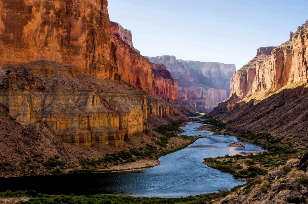 The Colorado River winds through the red rocks of Grand Canyon in the national park, listed as one of the top places for a US vacation