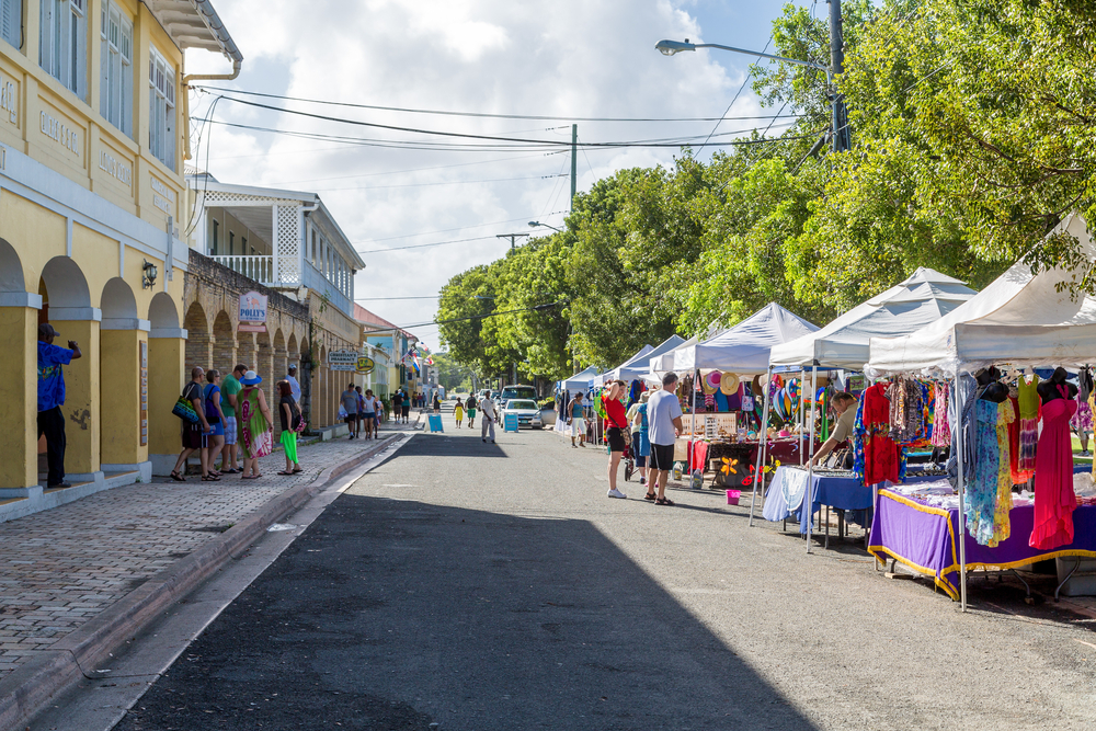 Open-air market in the USVI of Saint Croix pictured for a guide to whether or not the Virgin Islands are safe to visit with people mulling about in daylight
