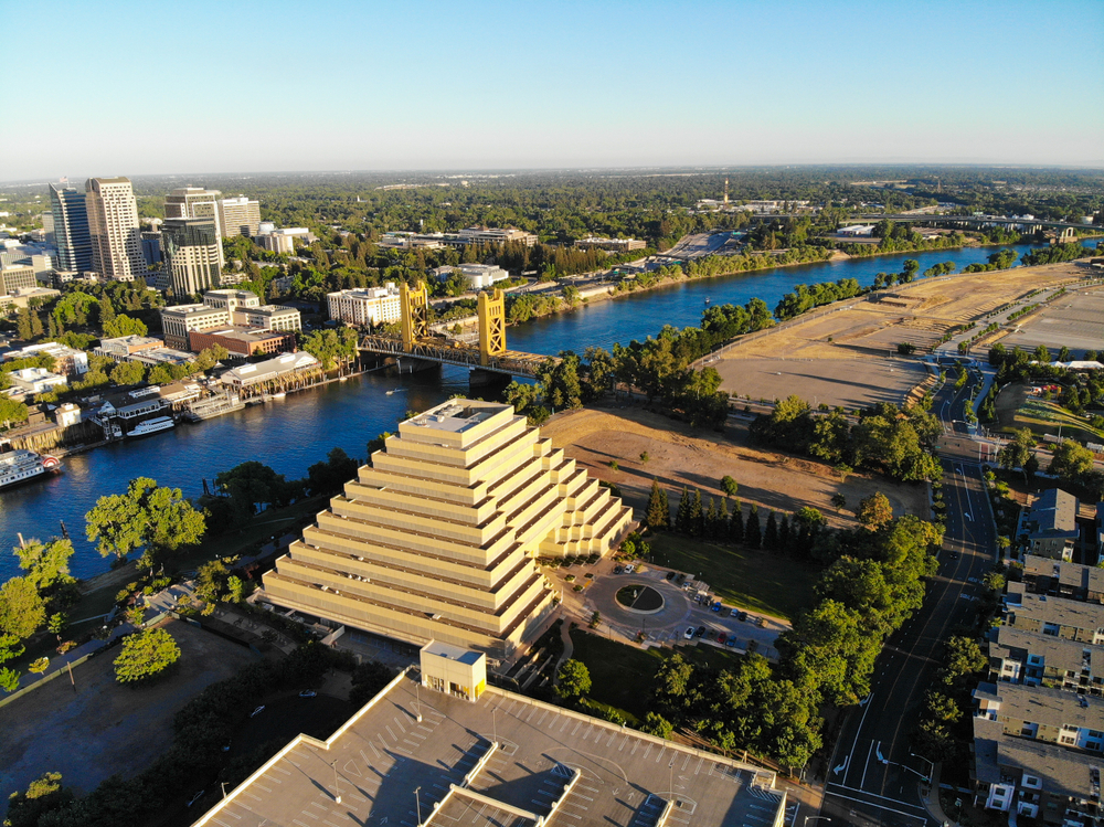 Aerial view of downtown Sacramento and pyramid-like building during daytime to show one of the top 5 cheap places to visit in the US
