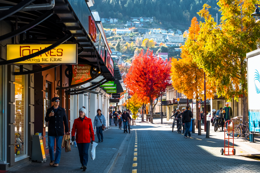 People making their way down the street in Queenstown during the fall season