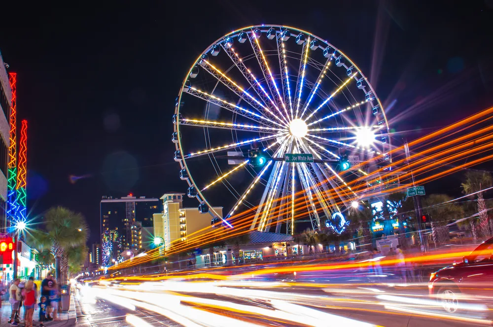 For a piece titled Is Myrtle Beach Safe to Visit, a night view of the giant Ferris wheel pictured in a long exposure image