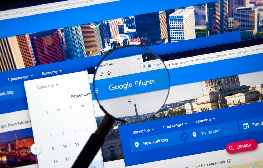 Magnifying glass accentuates Google Flights on the search page with multiple windows open to show how to use Google Flights for a complete step-by-step guide